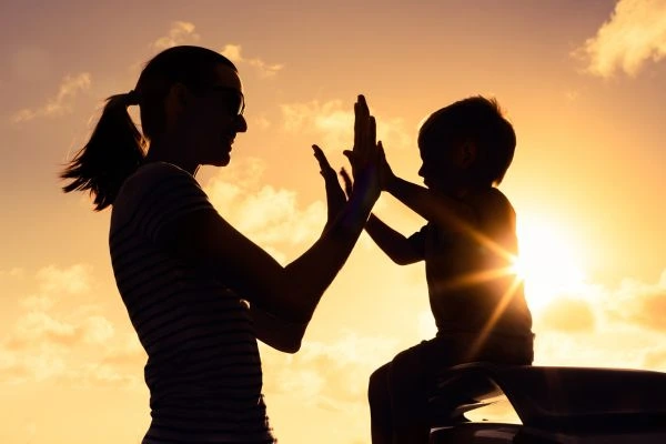 Image of happy mother and child after resolving child arrangements Corby